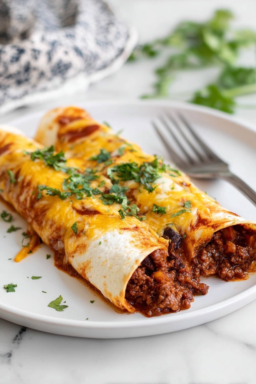 Beef Enchiladas - Two rolled enchiladas lie side by side on a white plate, each filled with a rich, dark brown meat mixture with visible small pieces of cooked onions and peppers spilling out at the front. The top of the enchiladas is covered with a layer of melted, golden cheese with some orange-red enchilada sauce peeking through. Fresh, chopped green cilantro is sprinkled generously over the cheese, adding a fresh touch of color. A silver fork rests on the plate behind the enchiladas, all set on a white marbled surface. Photo taken with an iphone --ar 2:3 --v 7