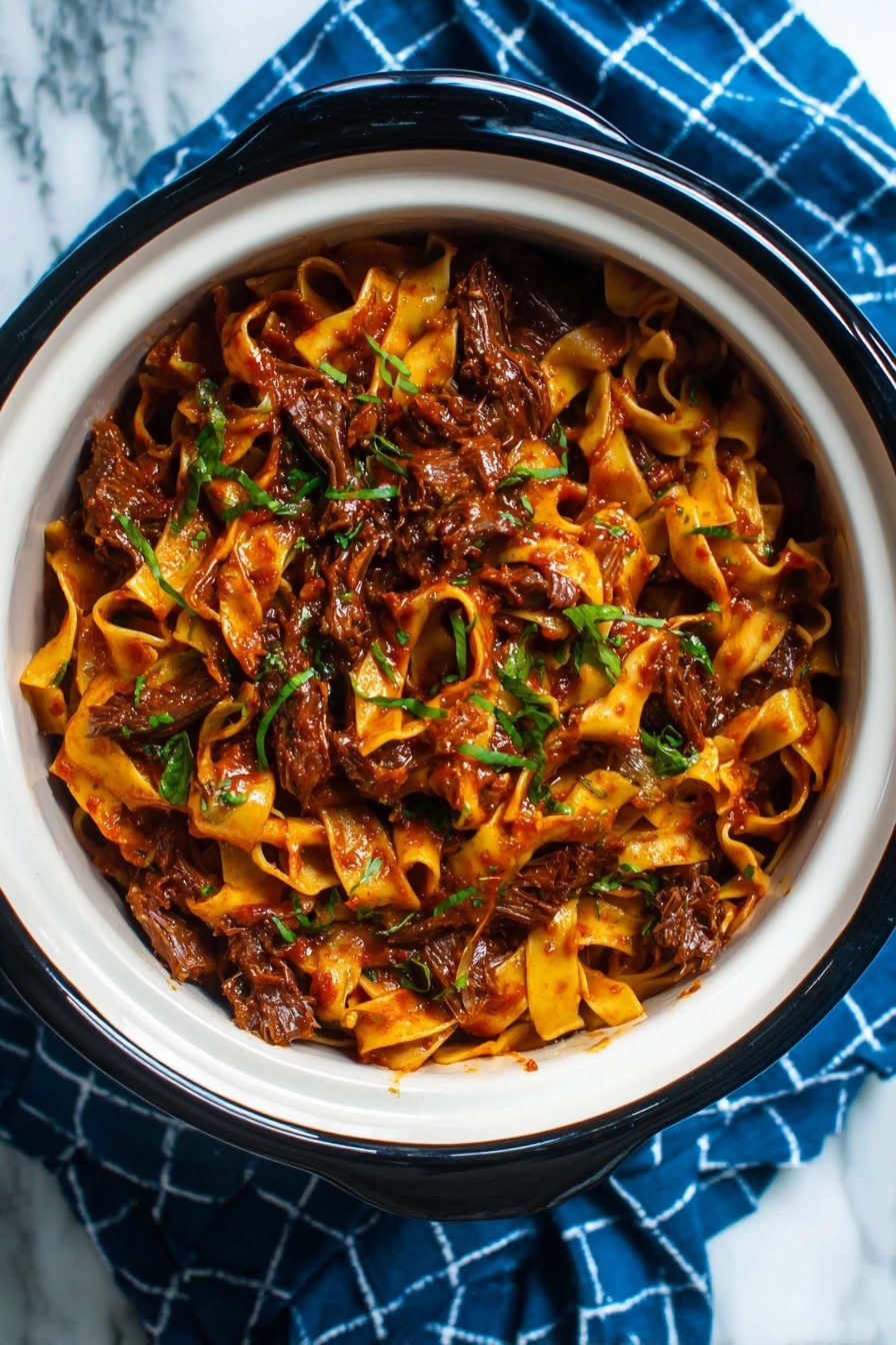 A white bowl filled with wide flat noodles coated in a thick dark reddish-brown sauce mixed with leafy green herbs, and tender chunks of dark brown meat all evenly distributed, set on a blue cloth with a white checked pattern, placed on a white marbled surface, photo taken with an iphone --ar 2:3 --v 7