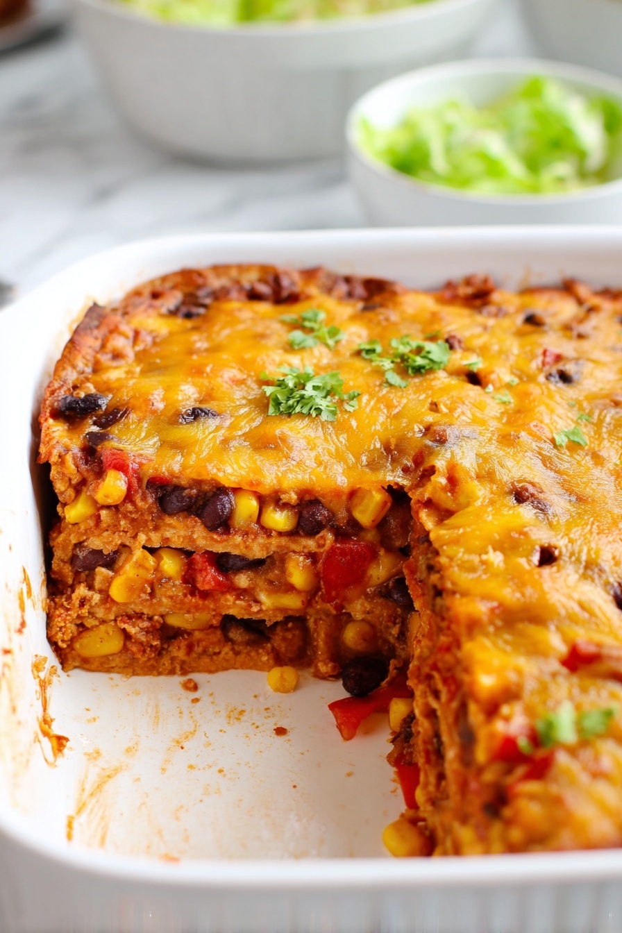 The image shows a white rectangular baking dish with a layered casserole inside. There are three visible layers: the bottom layer is soft and light brown, the middle layer is filled with diced red bell peppers, black beans, corn, and finely chopped onions mixing together with a reddish sauce, and the top layer is golden melted cheese with a slightly browned, bubbly texture. A triangular piece has been taken out, showing the thickness and detailed layers of the dish. In the blurred background, there are white bowls containing chopped green lettuce on a white marbled surface. photo taken with an iphone --ar 2:3 --v 7