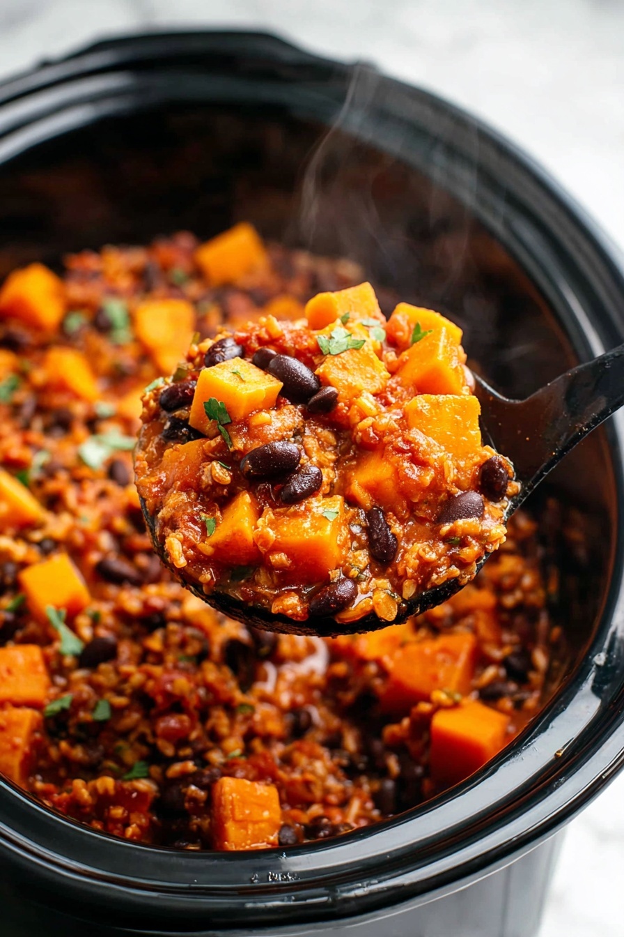 The image shows a close-up of a black slow cooker filled with a chunky stew. The stew has two main layers: a base layer of tender soft orange cubes likely squash or sweet potatoes, mixed with dark round beans, and a layer of brown rice or grains woven in, all covered in a rich reddish-brown sauce. The texture is thick and hearty, with herbs sprinkled on top for a touch of green color. Steam rises from the stew, showing it is hot and fresh. A shiny black ladle holds a scoop of the stew in the foreground, highlighting the mix of bright orange chunks, dark beans, and grains. The background is a smooth white marbled surface. photo taken with an iphone --ar 2:3 --v 7
