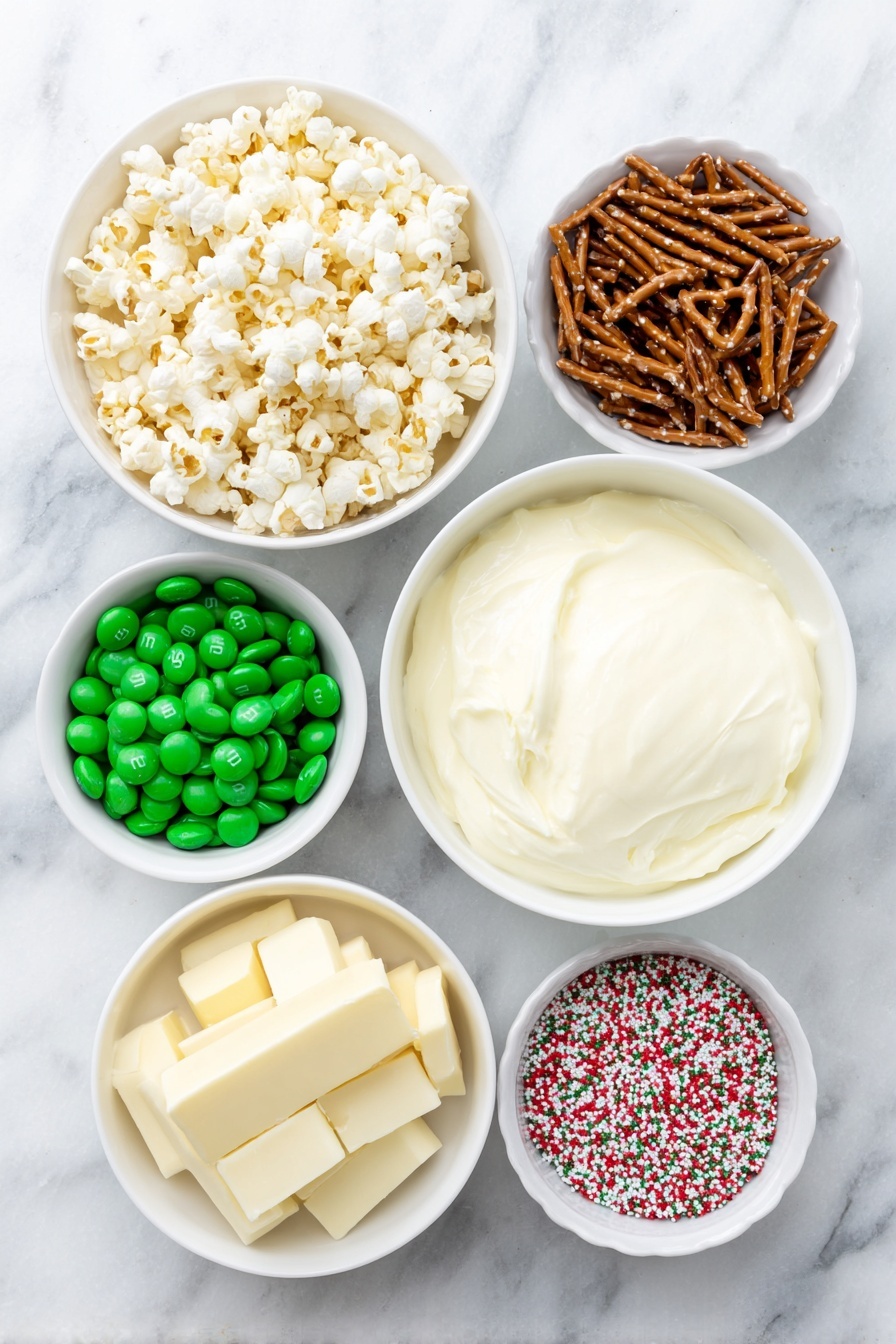 Flat lay of a small pile of natural, unpopped popcorn kernels, a handful of broken light brown pretzel pieces, a collection of green and red milk chocolate M&Ms scattered loosely, a mound of smooth white vanilla candy melts, and a small white ceramic bowl filled with colorful Christmas sprinkles, all arranged in perfect symmetry on a clean white marble surface, soft natural light, photo taken with an iPhone, professional food photography style, fresh ingredients, white ceramic bowls, no bottles, no duplicates, no utensils, no packaging --ar 2:3 --v 7 --p m7354615311229779997