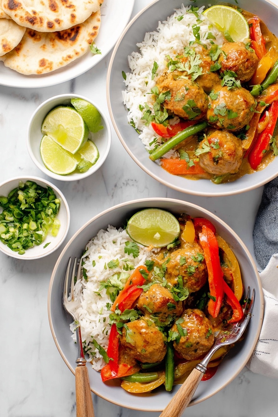 The image shows two white bowls filled with a colorful dish. Each bowl has a base layer of white rice topped with meatballs covered in a thick light brown sauce. Mixed with the meatballs are bright red and orange bell pepper strips, and green beans, adding vibrant color. Freshly chopped green onions and cilantro are sprinkled on top for garnish. Each bowl has a lime wedge placed inside, on the side of the dish. A silver fork with a wooden handle rests inside each bowl. Around the bowls are small white bowls containing extra lime wedges, chopped green onions, and cilantro, all set on a white marbled surface. In the top left corner, there is part of a white plate holding pieces of flatbread. photo taken with an iphone --ar 2:3 --v 7