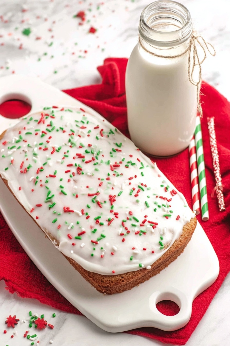 This image shows one large rectangular cake on a white ceramic serving board with a handle on the left side. The cake has one thick bottom layer of light brown color covered with a smooth layer of white frosting spread evenly on top. The frosting is decorated with small, round, and stick-shaped sprinkles in red, green, and a few white colors scattered all over its surface. The board and cake are placed on a white marbled surface with a bright red cloth underneath. To the right of the cake, there is a tall glass bottle filled with white milk tied with a thin string around its neck. Two colorful paper straws, one green and white striped and the other red and white striped, lie diagonally near the cake. A few sprinkles are also scattered loosely on the surface around the cake photo taken with an iphone --ar 2:3 --v 7