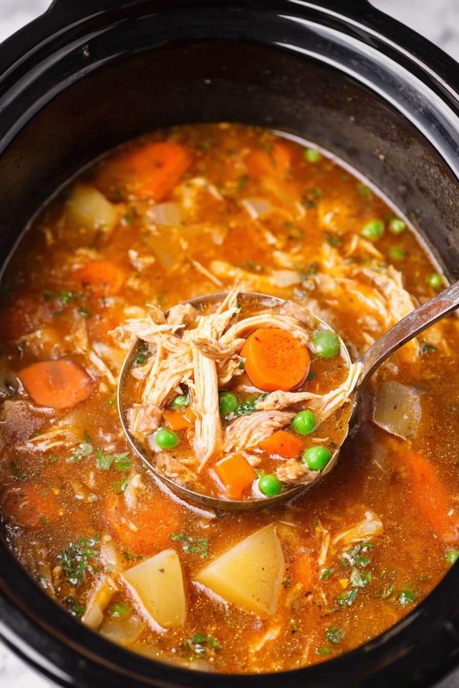A close-up of a black slow cooker filled with thick orange-brown soup showing three main layers: the top layer with bright orange carrot slices and small green peas floating, the middle layer with shredded light beige chicken pieces and chunks of pale yellow potatoes, and the bottom layer of rich, smooth broth with small bits of herbs. A spoon scoops some soup, showing a mix of all layers with glossy textures. The background is a white marbled texture photo taken with an iphone --ar 2:3 --v 7