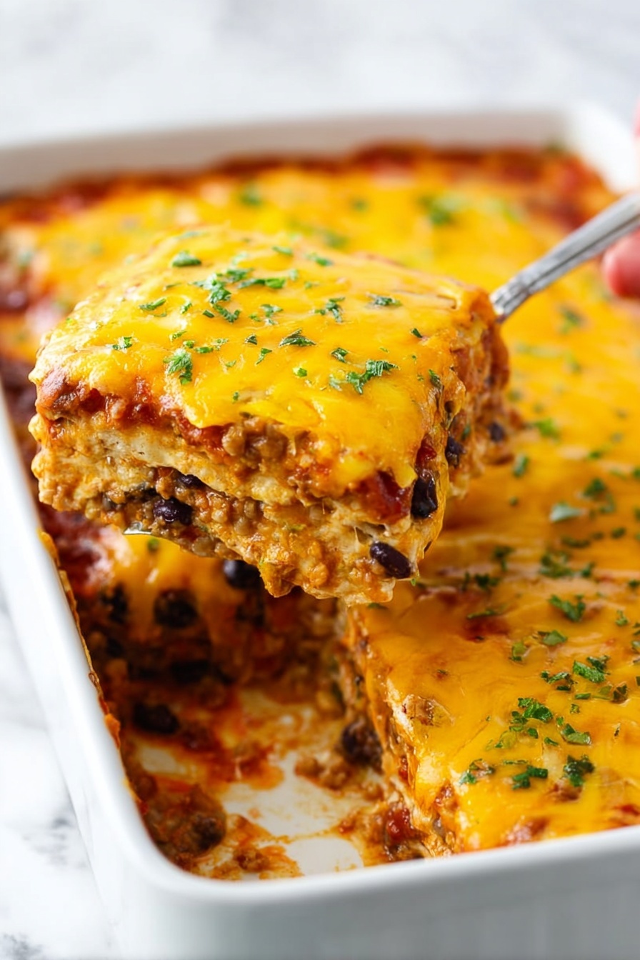 A close-up photo of a white rectangular baking dish filled with a layered casserole. The top layer is bright yellow melted cheese sprinkled with small green herb bits. Underneath, visible layers include a mixture of a tomato sauce with black beans and soft beige grains or small pasta, creating a thick filling. The edges of the dish show some baked sauce with slightly darker browned spots. A woman’s hand holding a utensil lifts a square slice, revealing three clear layers of cheese, sauce with black beans, and grains. The background is a white marbled surface. Photo taken with an iphone --ar 2:3 --v 7