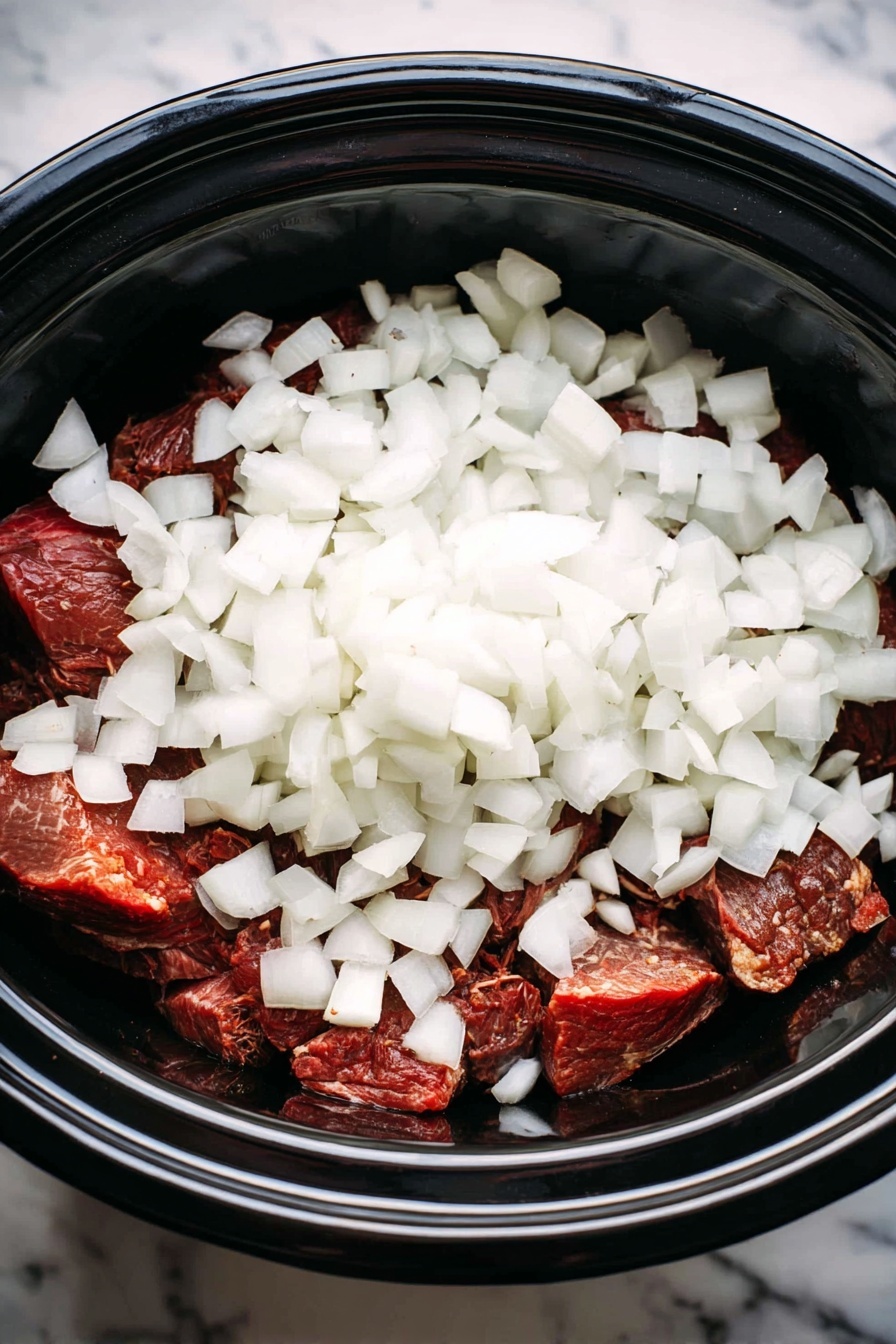 The dish shows a white plate with three main parts: in the bottom right, shredded brown beef with visible strands and some sauce on top, a fork grabbing the beef; above the beef, bright green cooked green beans with some black pepper sprinkled on them; to the left, a large scoop of light creamy mashed potatoes topped with brown gravy and black pepper. A small bowl with light creamy horseradish is partially visible in the bottom left corner. The plate rests on a white marbled surface. Photo taken with an iphone --ar 2:3 --v 7